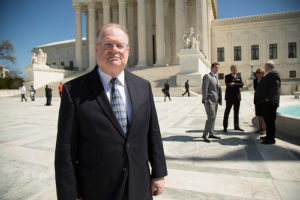 Reed at SCOTUS with background attys clients