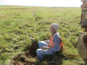 A federal consultant, sitting in a navigable water, thinking about something