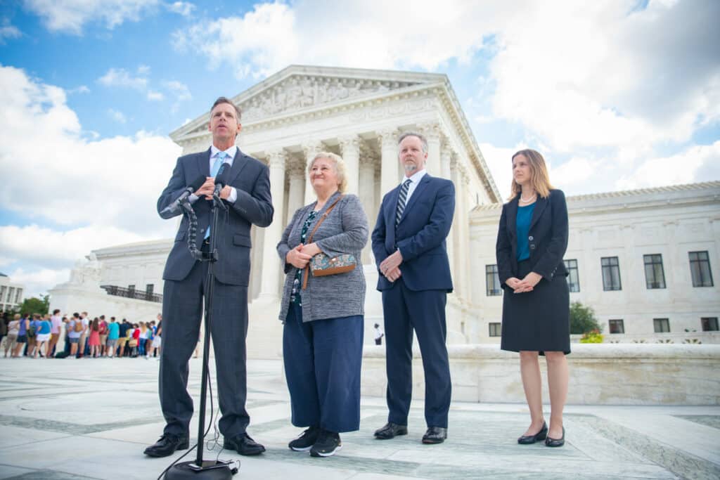 PLF Attorney David Breemer with Mary Rose Knick in front os the U.S. Supreme Court