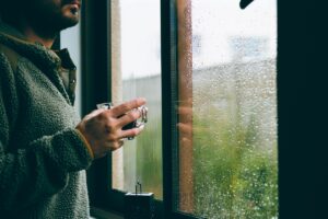 Man at rainy window