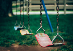empty swings on playground optimized