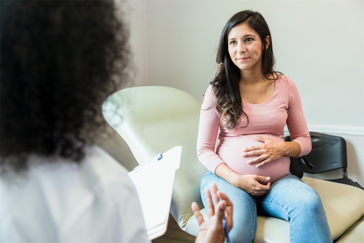 Pregnant woman meeting with a doctor