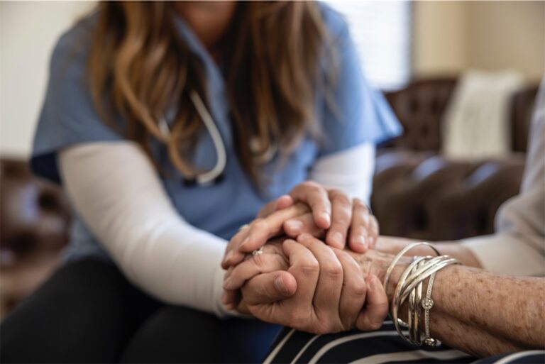 Nurse Holding Patients Hand