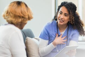 Nurse talks to patient
