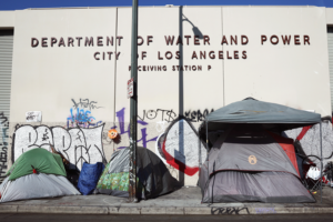 A homeless encampment stands in front of a city water and power building in the Skid Row community on September 28, 2023 in Los Angeles, California