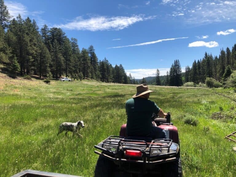 A PLF client sitting on a four-wheeler on his property in New Mexico.
