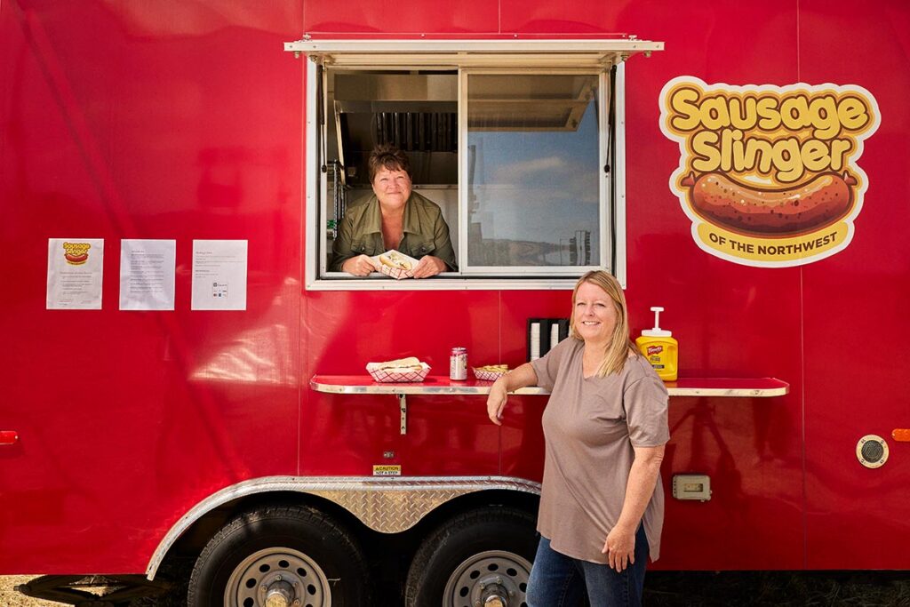 Heather Kratt and Holly Manzano with their food truck, Sausage Slingers of the Midwest. Photography Credit: Rick Wenner.